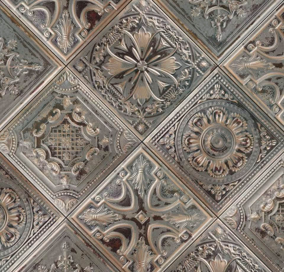 Ornate embossed ceiling tiles with Victorian floral and geometric patterns in metallic finish