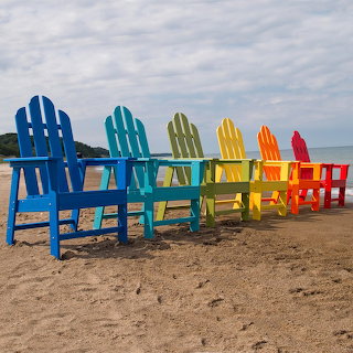 Rainbow Adirondack Chairs on Beach