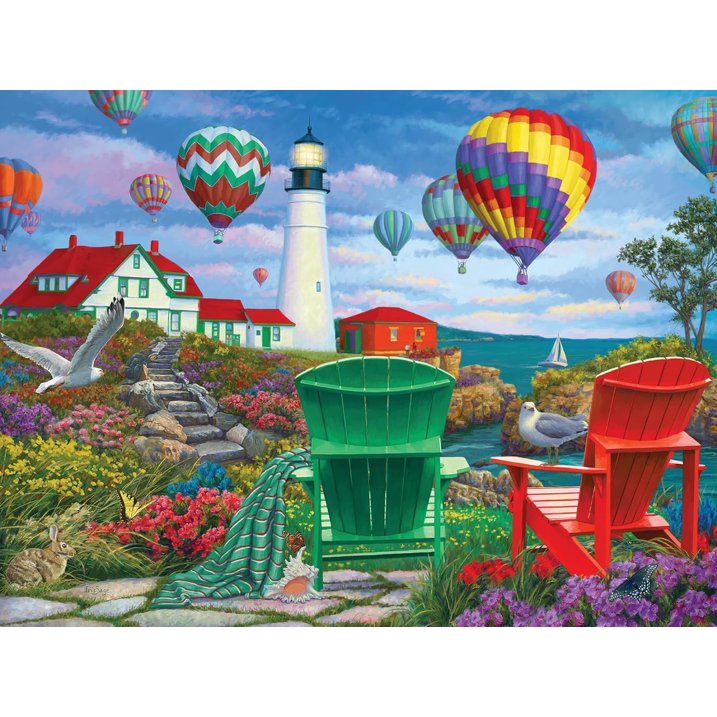 Hot air balloons over lighthouse with colorful chairs and garden by the sea