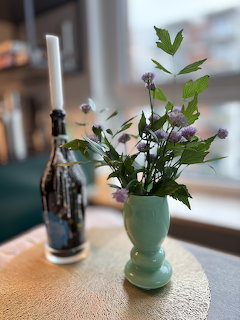 Flowers and Candle on Table
