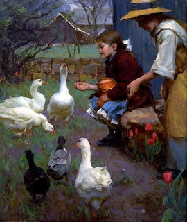 Two children crouching to feed white geese and ducks in a farmyard with cottage in background