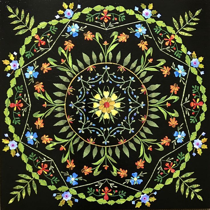 Circular floral mandala with yellow center, green leaves, and colorful flowers arranged symmetrically on black background