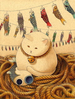 White cat with bell collar on rope coils beneath decorative fish windsocks