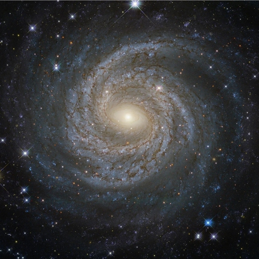 Spiral galaxy with a bright center and star-filled space background