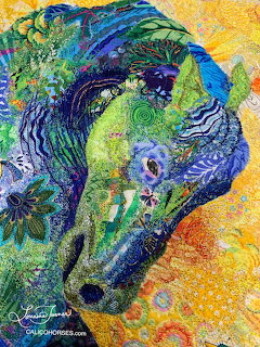 Colorful textile-style art showing a horse head in blue, green, and yellow patterns
