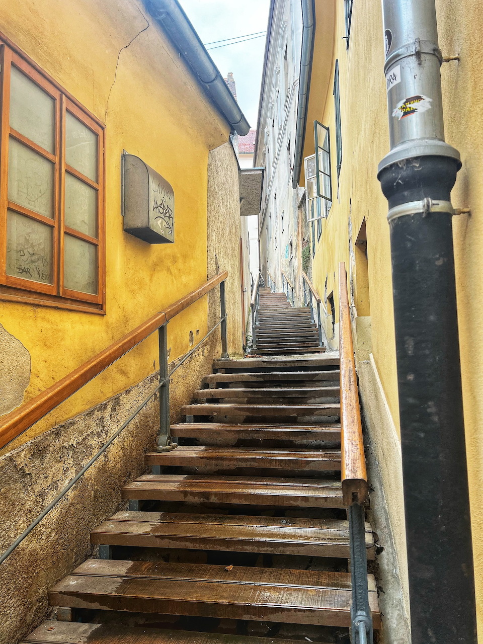 Narrow stairway between yellow old buildings in Zagreb's Gornji Grad upper town, Croatia