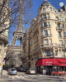 Street view of Parisian café with Eiffel Tower and classic architecture