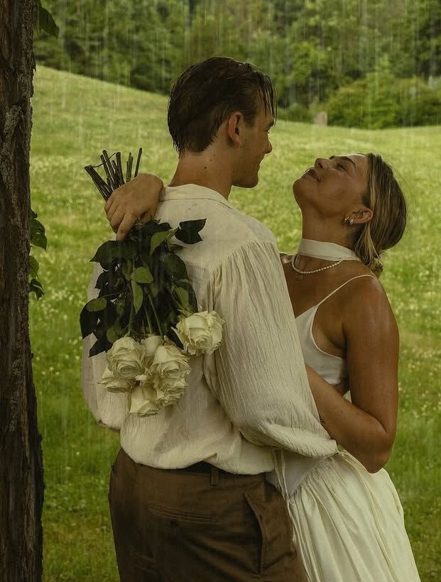 Newlywed couple in wedding attire posing together
