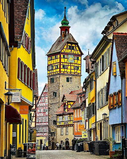 Colorful historic street in Schwäbisch Hall with a half-timbered tower and old buildings