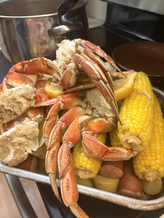 Florida stone crab claws on a plate with mustard sauce and lemon