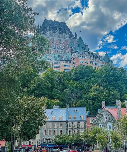 Historic cobblestone street lined with stone buildings in Old Quebec City