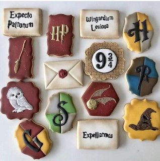 Harry Potter themed decorated cookies with Hogwarts symbols, spells, Hedwig, and Platform 9 3/4