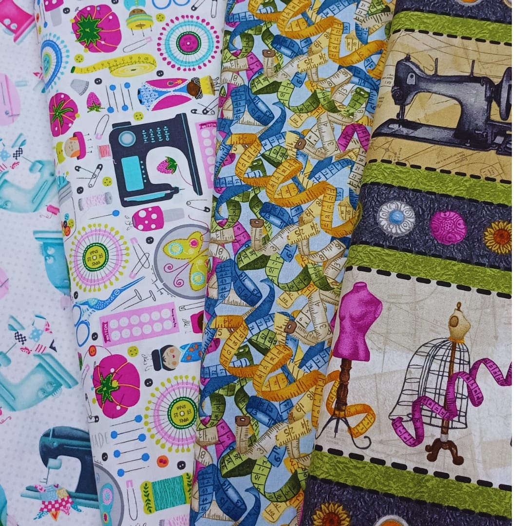 Colorful patchwork fabric strips with sewing patterns, ribbons, mannequins, and a sewing machine