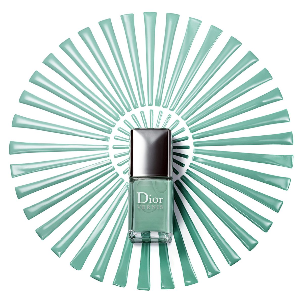 Green Dior nail polish bottle on radiating teal striped background