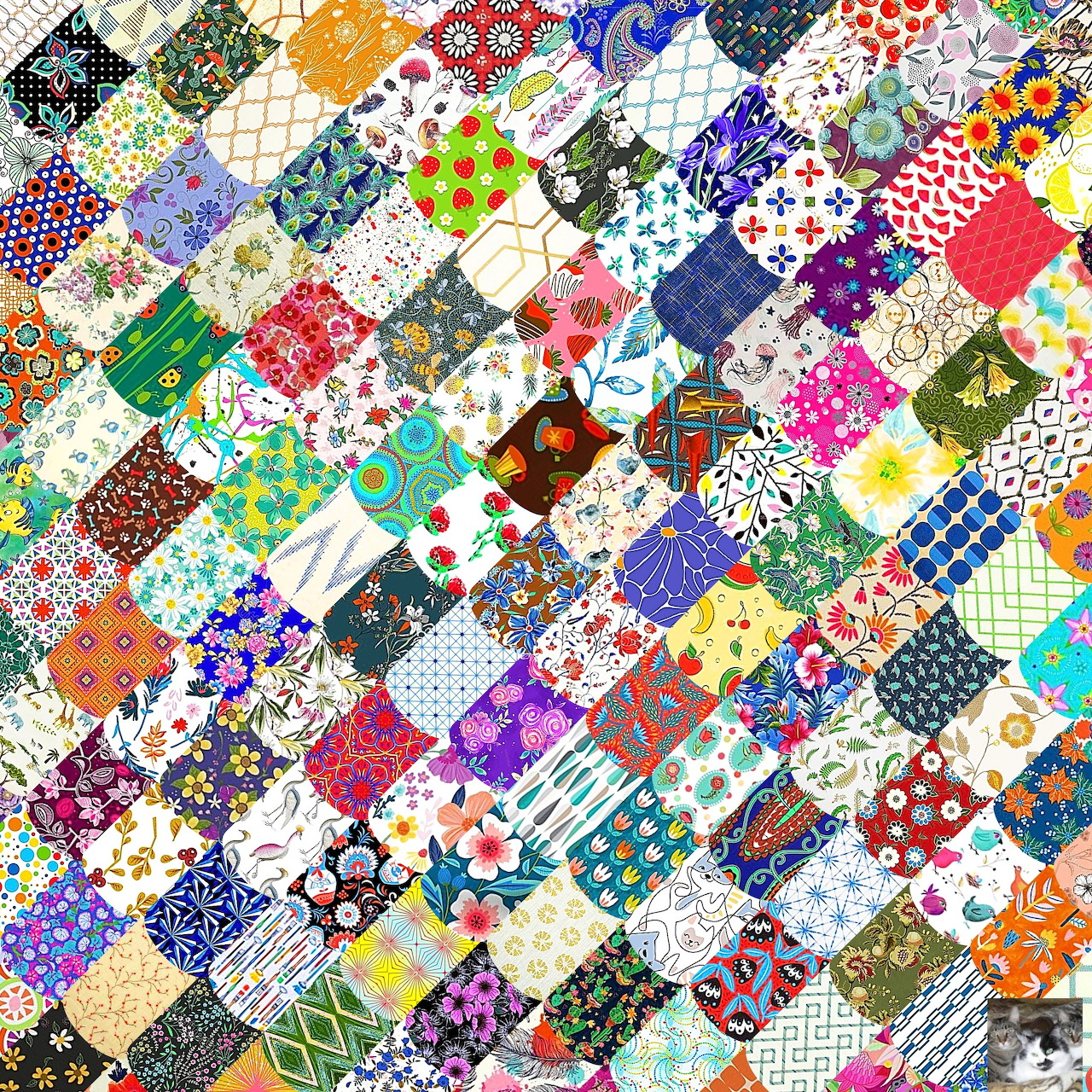 Colorful patchwork quilt with diverse patterns including florals, geometrics, and polka dots arranged in diamond layout