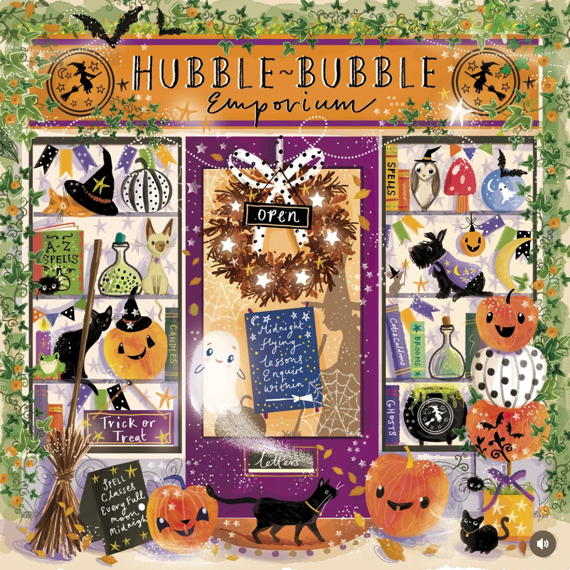 Halloween decorated store window with pumpkins, ghosts, witches, broom, cauldron and autumn wreath around purple door