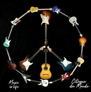 Artwork showing guitars arranged as a peace symbol around a woman's face on a black background