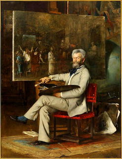 Painted portrait of bearded man in grey suit seated in artist studio with large painting behind him