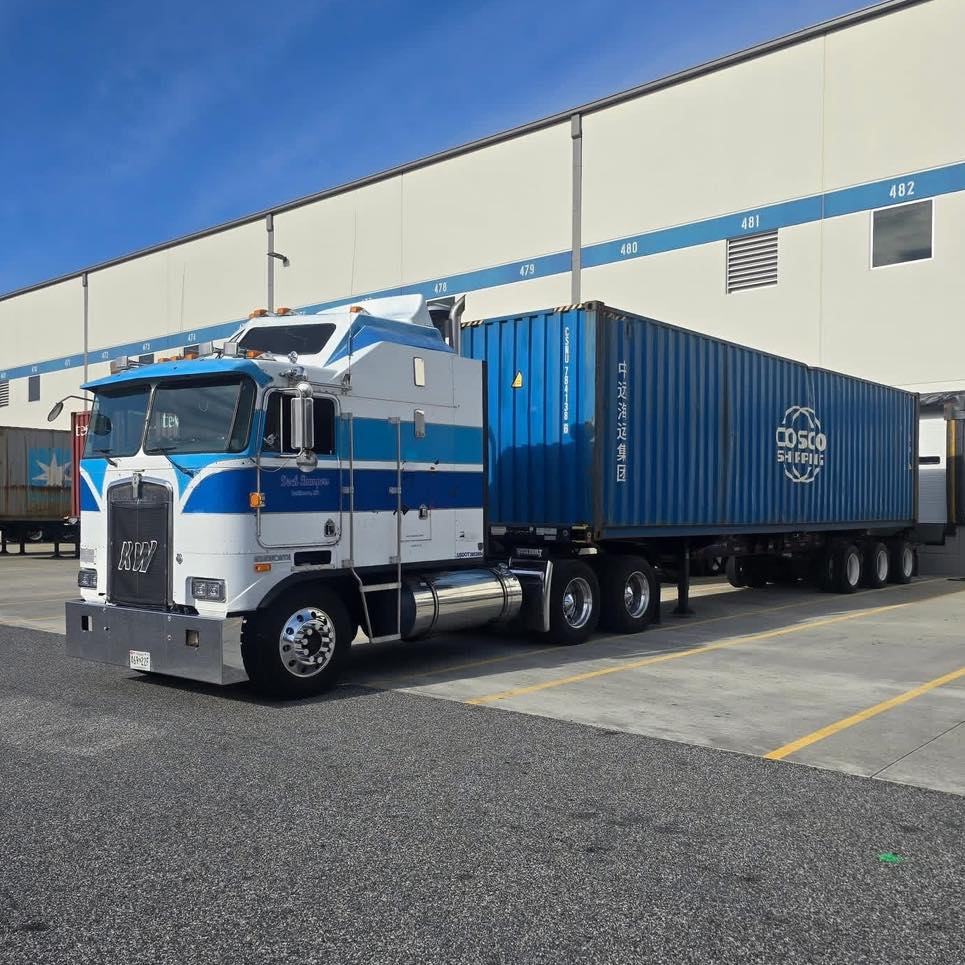 White Semi Truck Blue Trailer