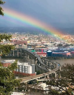Rainbow Over City Bridge