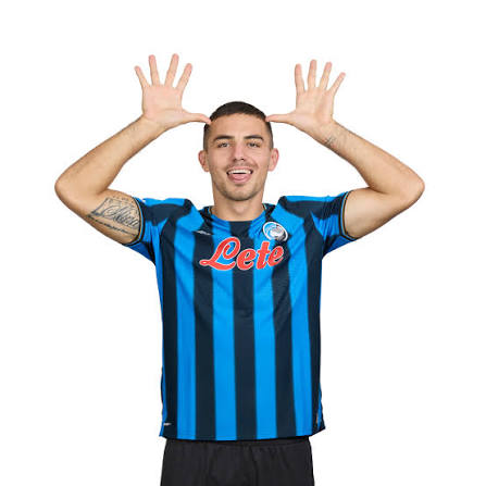 Soccer player in blue striped jersey with hands raised by head