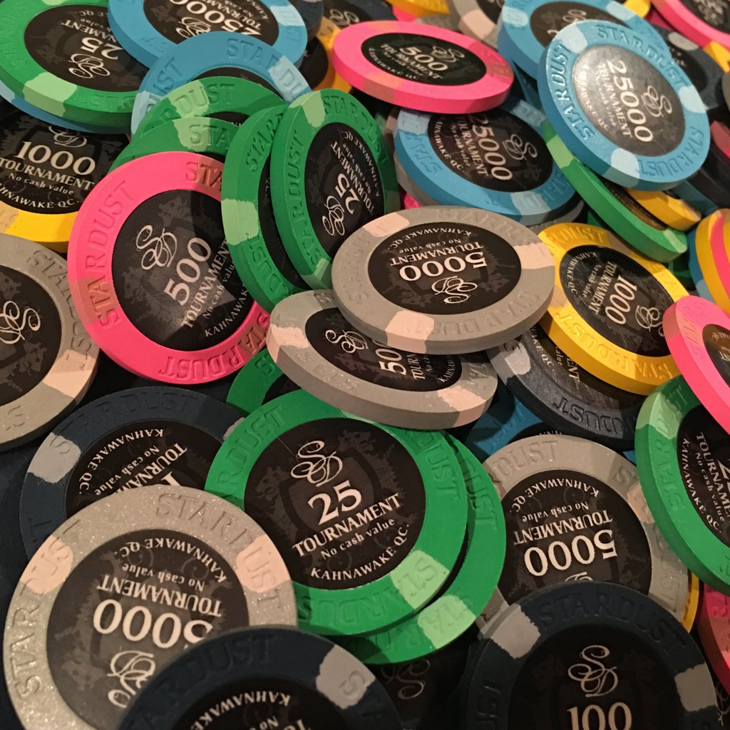 Colorful stacked casino poker chips with various denominations