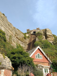 West Hill Lift funicular railway in Hastings with red station building and tracks ascending cliff