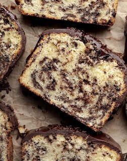 Sliced chocolate marble cake with swirled pattern on parchment paper