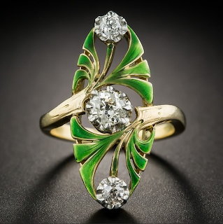 Gold Art Nouveau ring with green enamel leaf design and three diamonds