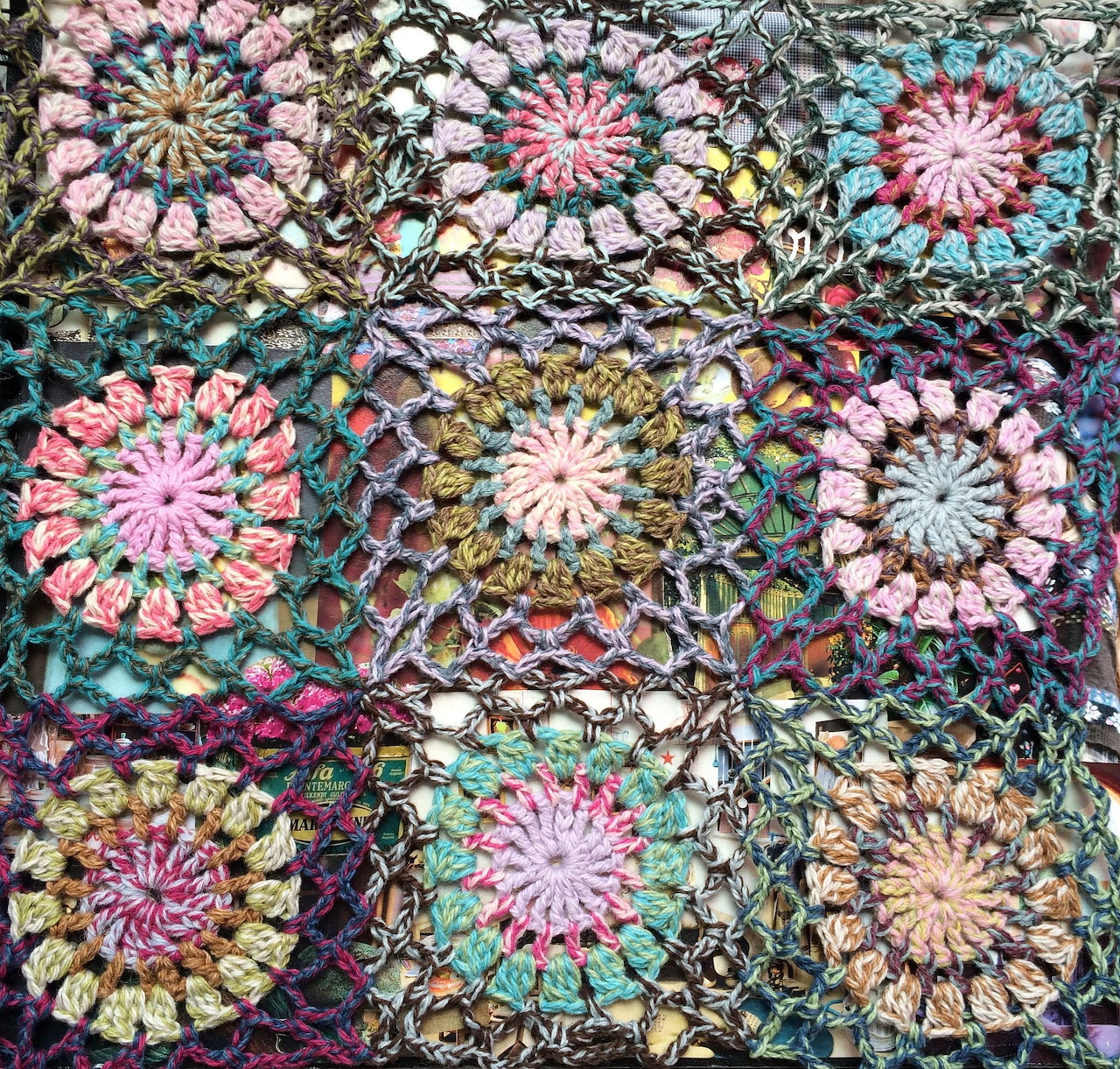 Grid of colorful crocheted granny squares with floral centers in pink, blue, yellow and purple yarn