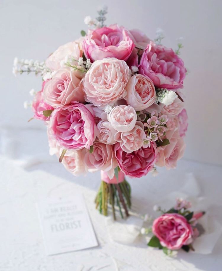 Colorful bouquet of mixed flowers with green leaves