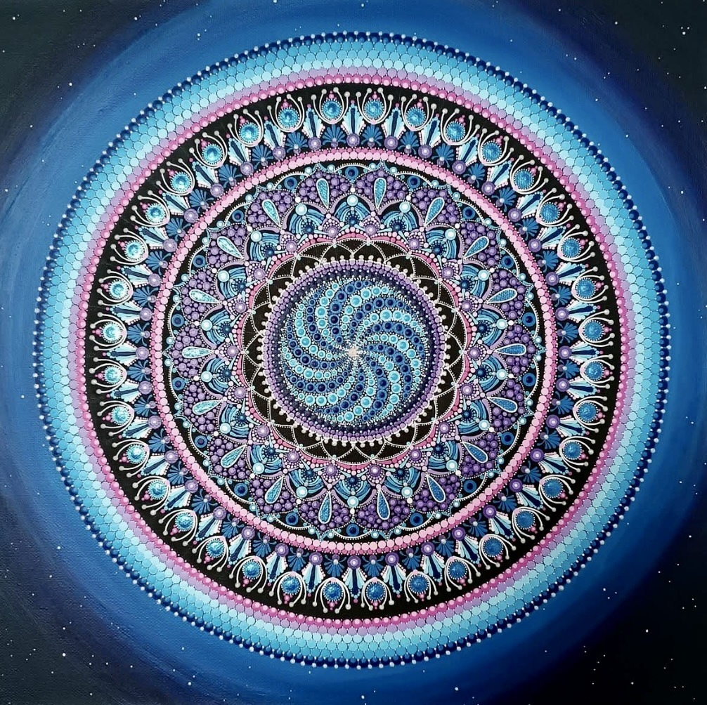 Circular mandala with spiral center, intricate geometric patterns, and blue starry background