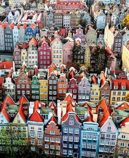 Dense view of colorful historic townhouses and red roofs in Gdansk old town