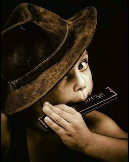 Child Playing Harmonica