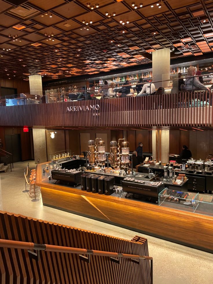 Interior of Starbucks Reserve Roastery with bar counter, copper equipment, and slatted wood ceiling