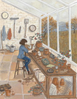 Person at potting bench in greenhouse with plants and gardening tools