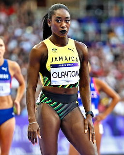 Jamaican female sprinter Clayton standing on a track during a race event