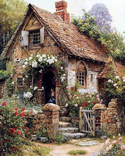 Stone cottage with flowers and thatched roof in country garden