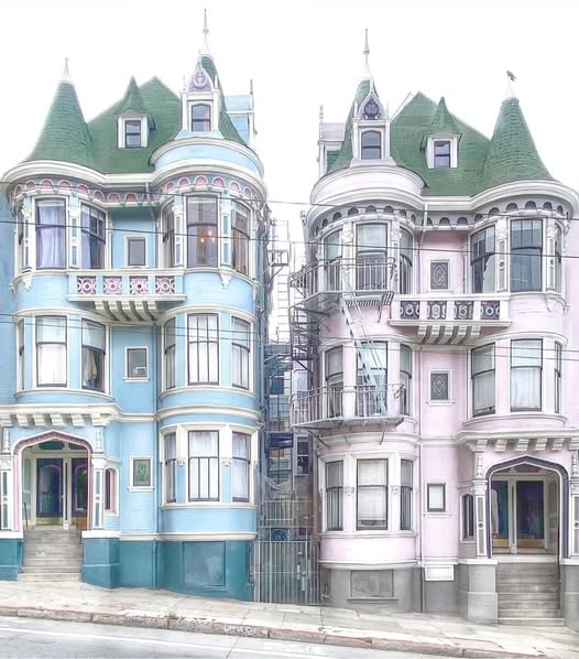Two Victorian houses, one blue and one pink, with green roofs and ornate detailing on a San Francisco street.