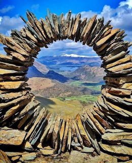 Circular driftwood frame with view of Lake District mountains and valleys, Cumbria England