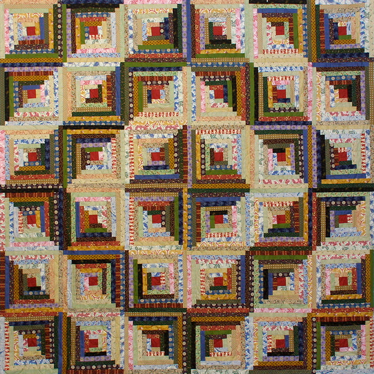 Log cabin quilt with repeating geometric blocks in brown, cream, and colorful fabric strips