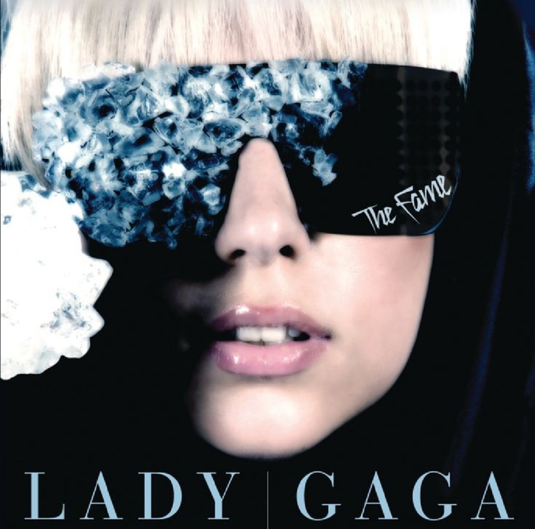 Close-up album cover portrait of Lady Gaga wearing large reflective sunglasses