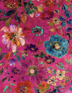 Vibrant embroidered floral pattern with colorful flowers on magenta fabric