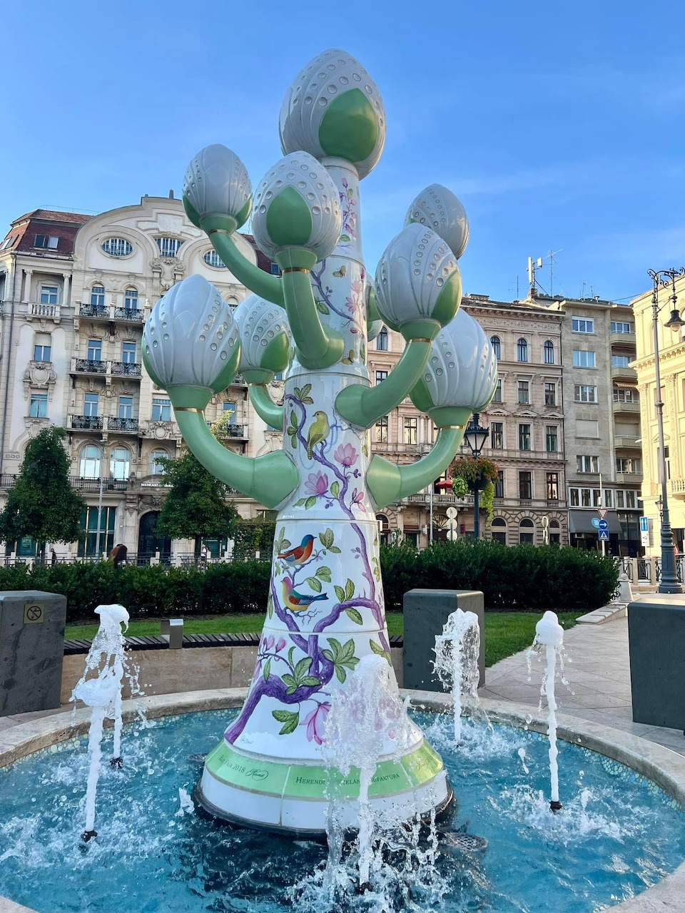 Decorative ceramic fountain with hand-painted floral design in Budapest city square