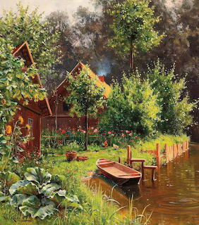 Red cottage beside lake with green trees and moored boat in peaceful rural setting