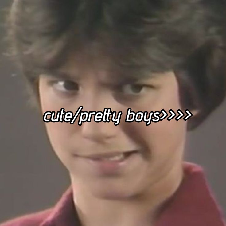 Close-up portrait of young Ralph Macchio in a red shirt with text overlay