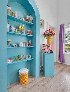 Pastel ice cream themed house with cone roof accents and colorful candy-like details