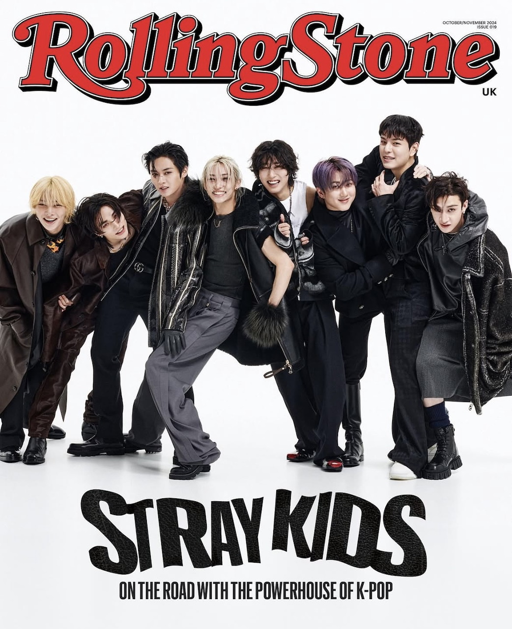 Stray Kids K-pop group on Rolling Stone UK magazine cover wearing dark stylish outfits