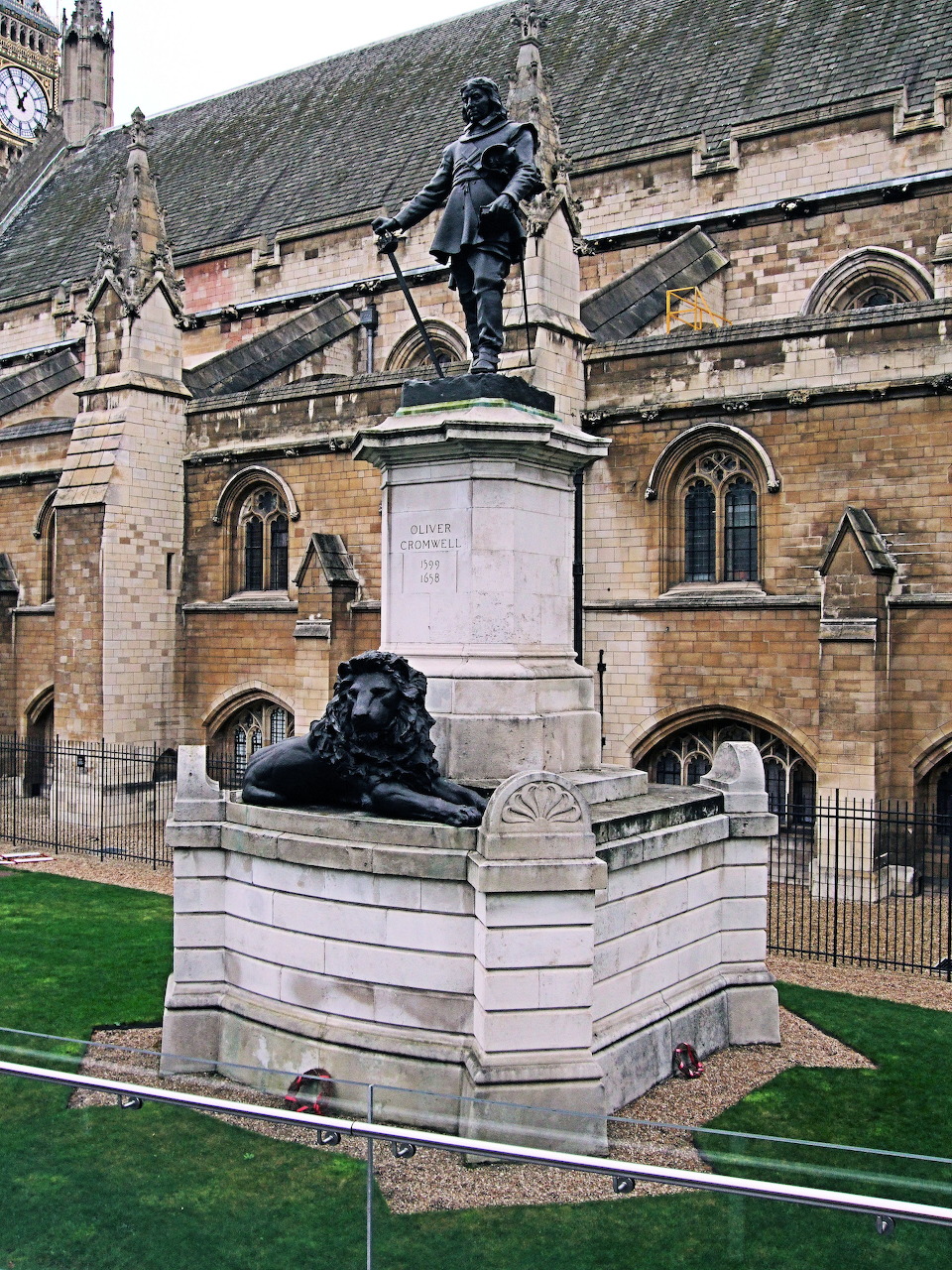 Bronze Oliver Cromwell statue on stone pedestal outside Westminster, London