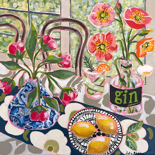 Vibrant still life painting with citrus fruits, pink flowers in blue vase, and gin bottle near window with decorative ironwork